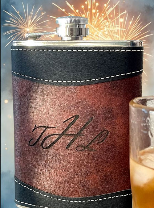 A leather-bound flask with decorative stitching