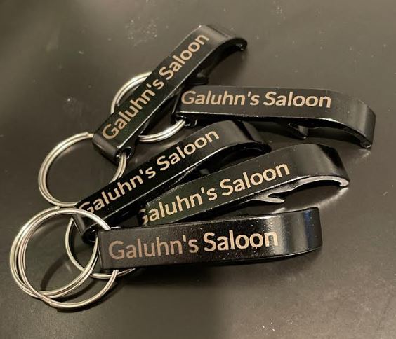 A personalized bottle opener keychain featuring a custom design, perfect for gifts or personal use.